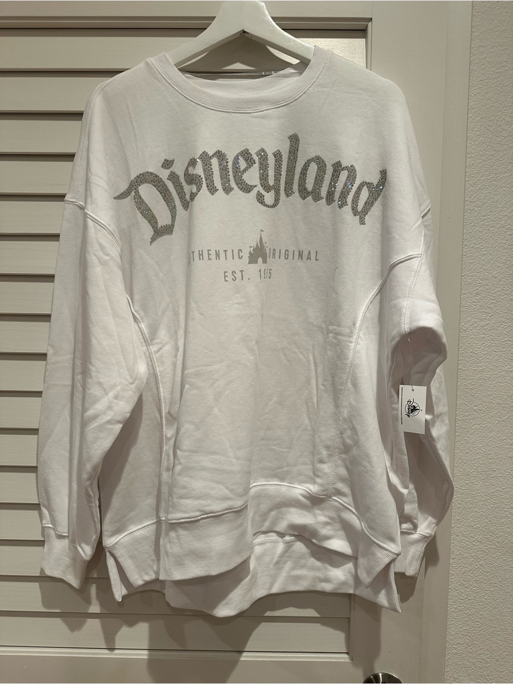 NWT Disney White Crewneck Sweatshirt with Silver Disneyland Logo us size M